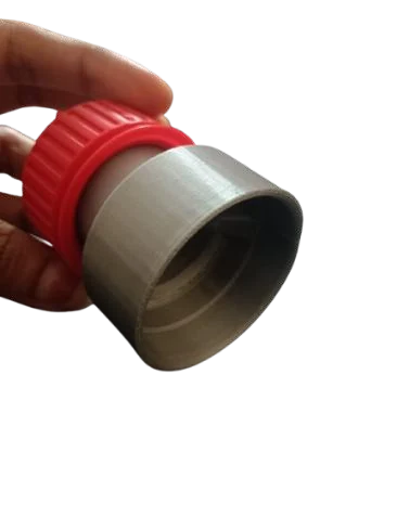 The silver bottle body with a red cap, held in a hand