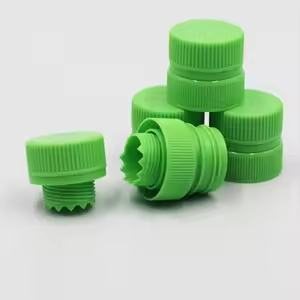 A stack of green screw caps